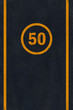 Yellow 50 limit speed caution marking on asphalt pavement Yellow 50 limit speed caution marking on asphalt pavement
