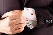 Business man with card and he has an ace up his sleeve