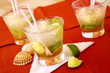 Brazilian caipirinha cocktails with limes and sea-shells