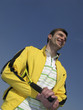 player in tennis on blue background sky iin sunny day