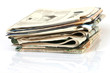 media concepts stack of newspapers with reflection isolated
