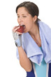 Young woman bitting a red apple. Young woman bitting a red apple.