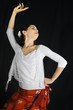 Portrait of young hispanic woman dancing flamenco