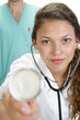 close up of lady doctor with stethoscope