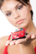 Close-up of red toy pick-up on palm