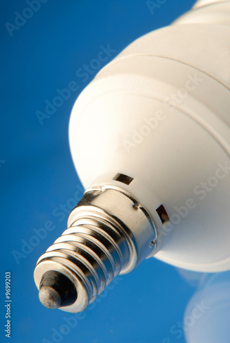 Photo: socle of an electric lamp on blue background socle of an electric lamp on blue background