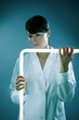 Italian woman holding neon stick in lab.