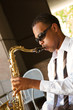 An youung and trendy African-American sax musician
