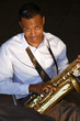 An youung and trendy African-American sax musician