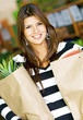 woman in a supermarket with shopping bags