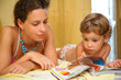 Mother and child read magazine