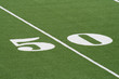 Fifty yard line at a turf covered football field