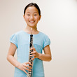 Confident musician holding clarinet
