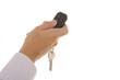 Man hand holding a garage door remote control Man hand holding a garage door remote control
