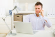 Business man working on laptop computer at home