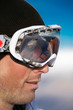 Face shot of snowboarder wearing goggles - profile