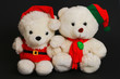 christmas teddy bears isolated in black background. christmas teddy bears isolated in black background.