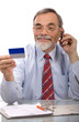 Businessman making a credit card purchase by phone