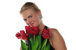 woman with tulips and revolver isolated on white background