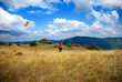 Fly the kite on the top of the mountain