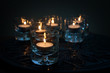 Photo: Six Tealights on Carved Wood Six Tealights on Carved Wood