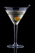 Classical martini in chilled glass over black background