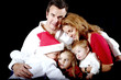 Portrait of a beautiful family of five all snuggled together