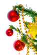 Christmas tree branch with three shining red decoration balls
