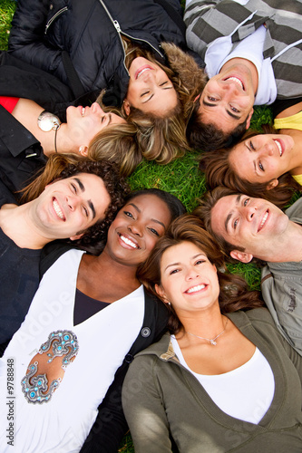 Photo: happy group of friends smiling outdoors in a park happy group of friends smiling outdoors in a park