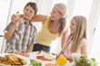 Mother And Children Prepare A meal,mealtime Together
