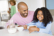 Photo: Father Sitting With Daughter As She They Eat Breakfast With Her Father Sitting With Daughter As She They Eat Breakfast With Her