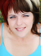 portait of beautiful young woman on the grass