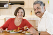 Photo: Elderly Couple Enjoying meal,mealtime Together Elderly Couple Enjoying meal,mealtime Together