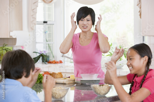 Photo: Children Play Fight While Having Breakfast Children Play Fight While Having Breakfast