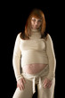 happy pregnant woman portrait isolated on black background