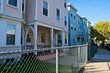 chain link fence follows the sidewalk