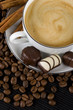 Cup of espresso coffee with chocolate candies