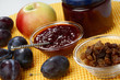 Plum jam and raisins in glass bowl Plum jam and raisins in glass bowl