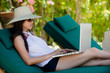 girl using laptop while relaxing