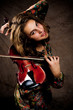 young girl playing violin, unusual pose