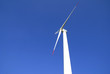 Wind turbine against blue sky