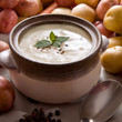 Fresh potato soup garnished mint and sprinkled with black pepper Fresh potato soup garnished mint and sprinkled with black pepper