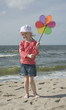 Cheerful little girl with pinwheel