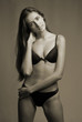 woman in underwear on dark background