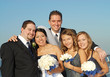 Photo: Happy bridal party outside during a wedding Happy bridal party outside during a wedding