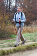 Photo: Young female hiking in the forest. Fall time Young female hiking in the forest. Fall time