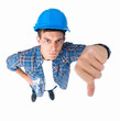 Closeup portrait of young man showing thumbs down Closeup portrait of young man showing thumbs down