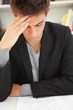 Closeup portrait of a young business man stressed Closeup portrait of a young business man stressed