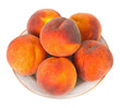 Juicy peaches on a plate over white background