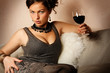 Portrait of beautiful woman with glass red wine